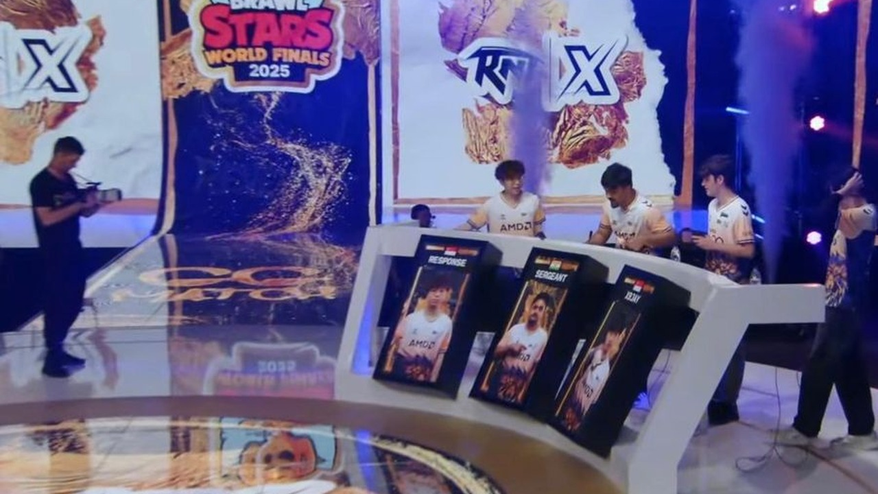 Revenant players stand at their desks on a Brawl Stars World Finals stage
