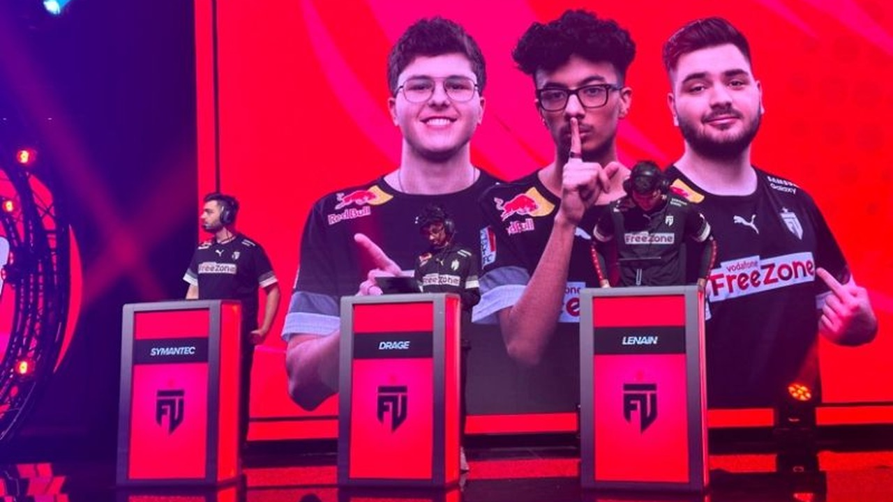 Three Brawl Stars players stand at tournament stations